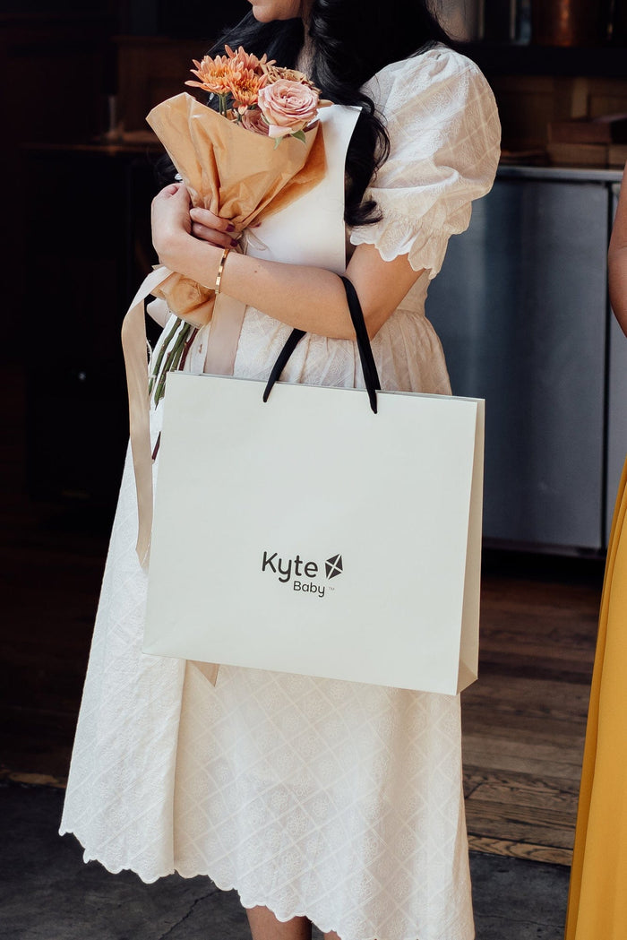 Woman with Kyte Baby Shopping Bag
