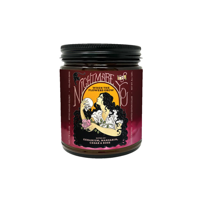 The Nightmare Of You floral candle comes in a dark red jar labeled โNightmare Before Coffee: When the Flowers Grow,โ featuring a woman with flowers. Enjoy scent notes of geranium, mandarin, cedar, and rose for a beautiful fragrance experience.