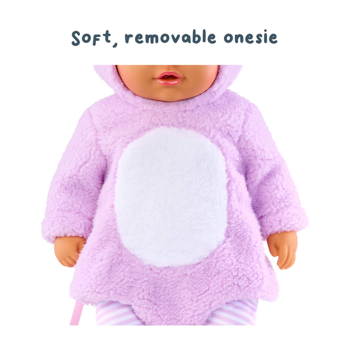 Doll wearing a pink onesie with a white circle on a white background