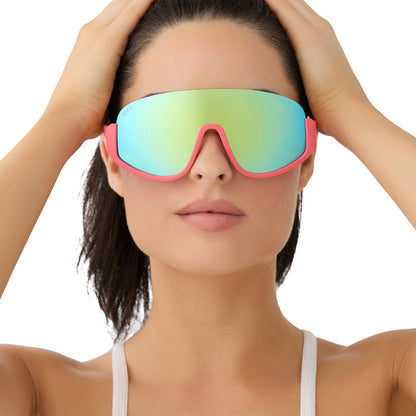 on model - female wearing diff sport featuring the blazer shield sunglasses with a coral frame and turquoise ice mirror polarized lenses front view