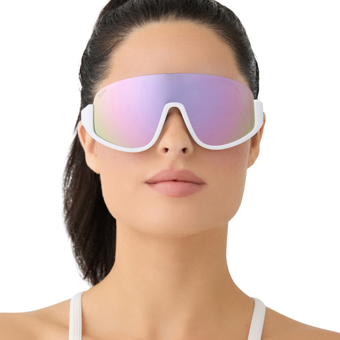 on model - female wearing diff sport featuring the blazer shield sunglasses with a matte white frame and lavender mirror polarized lenses front view