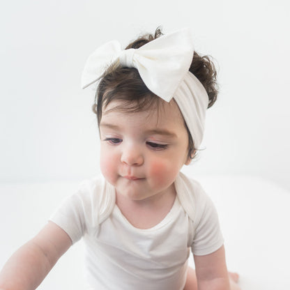 Toddler wearing Bow Headband in Cloud with matching white bow headband