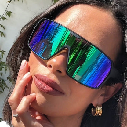 lifestyle - curatedcabrands wearing diff sport featuring the charge shield sunglasses with a matte black frame and green mirror polarized lenses