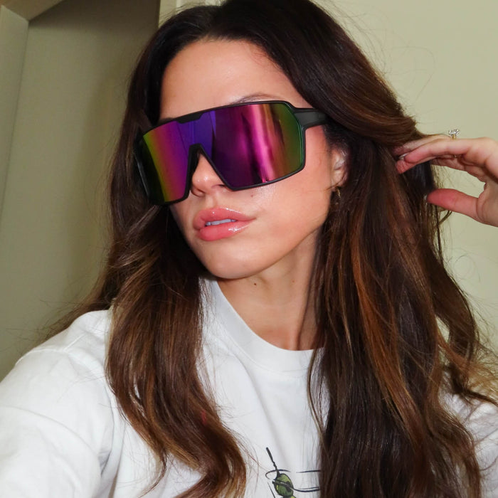 customer content - shannonvwilkie wearing diff sport featuring the charge shield sunglasses with a matte black frame and pink rush mirror polarized lenses