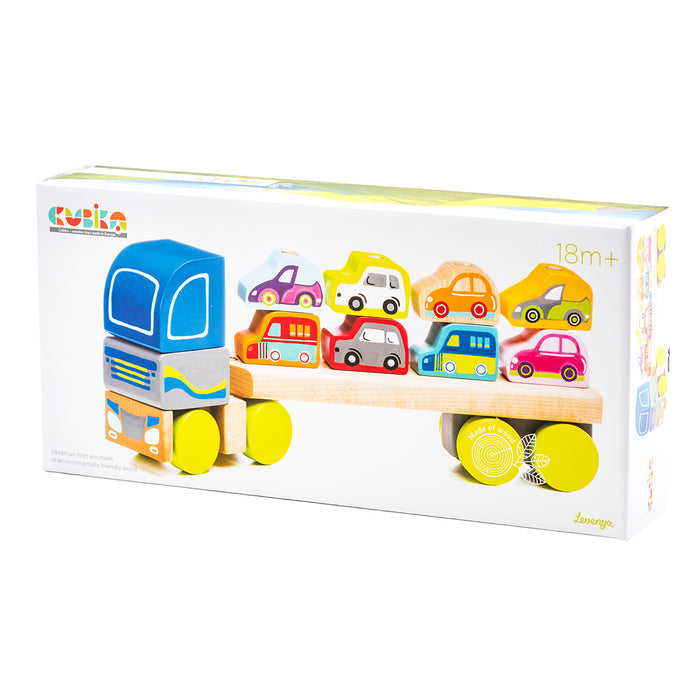 The Cubika Wooden Truck with Cars by Cubika is a colorful wooden toy set for children 18 months+, featuring a truck and six mini cars to encourage fine motor skills and imaginative play.