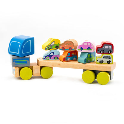The Cubika Wooden Truck with Cars by Cubika features a blue-cab wooden truck with yellow wheels carrying colorful mini cars, promoting fine motor skills development for children. Photographed on a white background.