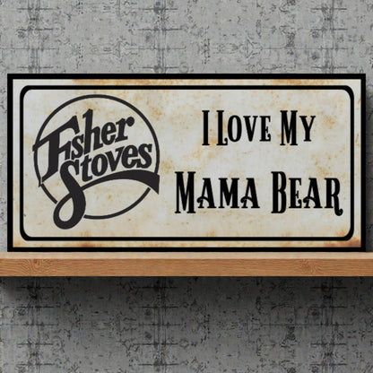Fisher Stoves sign with 'I Love My Mama Bear' text on a textured wall background