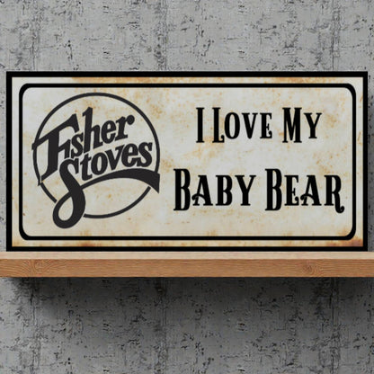 Fisher Stoves sign with 'I Love My Baby Bear' text on a textured gray background