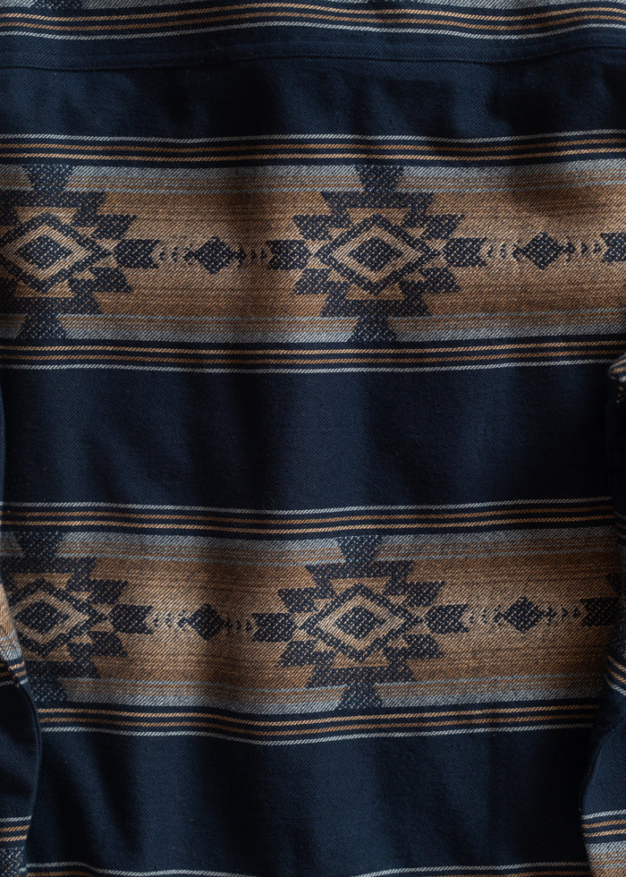 Navy and brown fabric with geometric Aztec patterns, featuring diamond shapes and intricate lines, creating a bold, textured design.