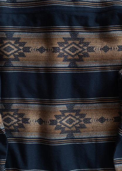 Navy and brown fabric with geometric Aztec patterns, featuring diamond shapes and intricate lines, creating a bold, textured design.