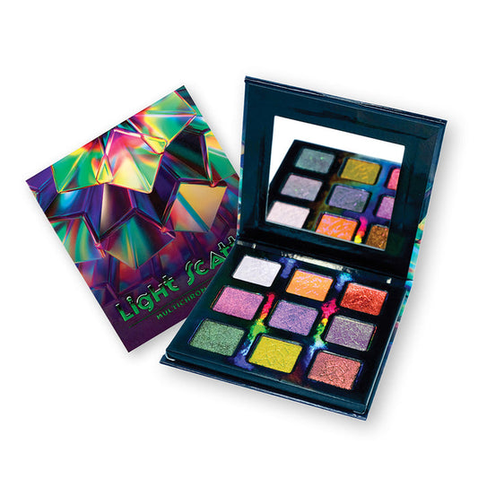 Close-up of an open Light Scatters Palette as well as it's outer packaging, on a white background.