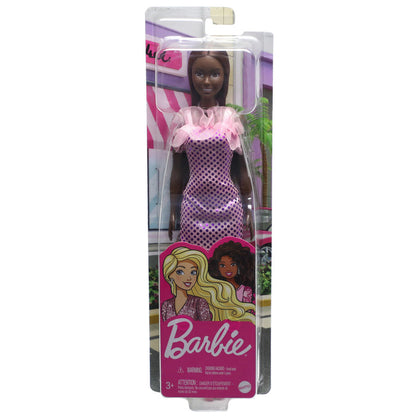 The Mattel Barbie Glitz Doll by Mattel features dark skin, long dark hair, and a pink and purple polka-dot dress, presented in a clear box—ideal for imaginative play and Barbie fans.