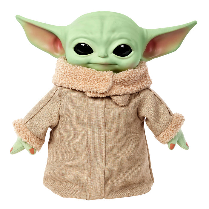 The Mattel Star Wars Grogu Squeeze & Blink plush features the big-eared character in a tan coat with fuzzy collar and cuffs. With expressive blinking eyes, it's a unique gift for any Star Wars fan.