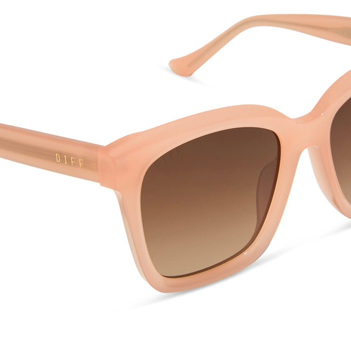 diff eyewear featuring the meredith square sunglasses with a peach frame and brown gradient polarized lenses detailed view