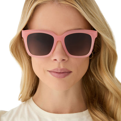 on model - female wearing diff eyewear featuring the meredith square sunglasses with a peach frame and brown gradient polarized lenses front view