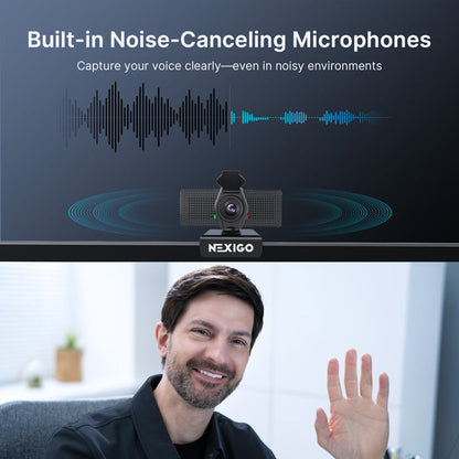 A man video chatting using a webcam with dual noise-canceling microphones.