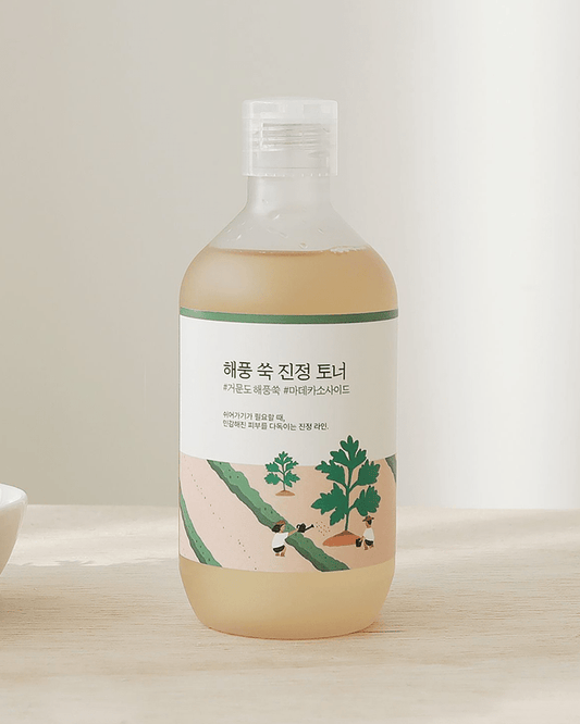 ROUND LAB Mugwort Calming Toner bottle on wooden table