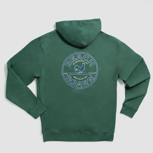 A green hoodie displayed flat with a large circular Beach & Barn logo and a chicken graphic printed on the back. The hoodie has long sleeves and a hood.