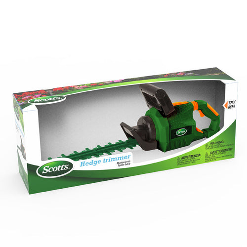 The Red Toolbox Scotts Battery-Operated Hedge Trimmer toy, with a green and orange handle, is displayed in retail packaging with a clear window and brand logos, offering kids a realistic and safe yard tool play experience.