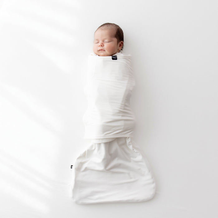 Baby sleeping swaddled in Sleep Bag Swaddler in Cloud 0.5