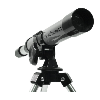 The black and gray Smithsonian Telescope / Monocular by Smithsonian, ideal for beginner astronomy and STEM learning, is mounted on a tripod and angled upward against a plain white background.