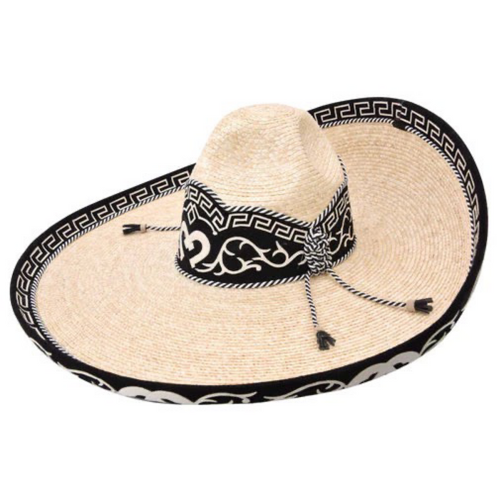 A traditional Mexican sombrero with a white brim and black band featuring a geometric pattern.