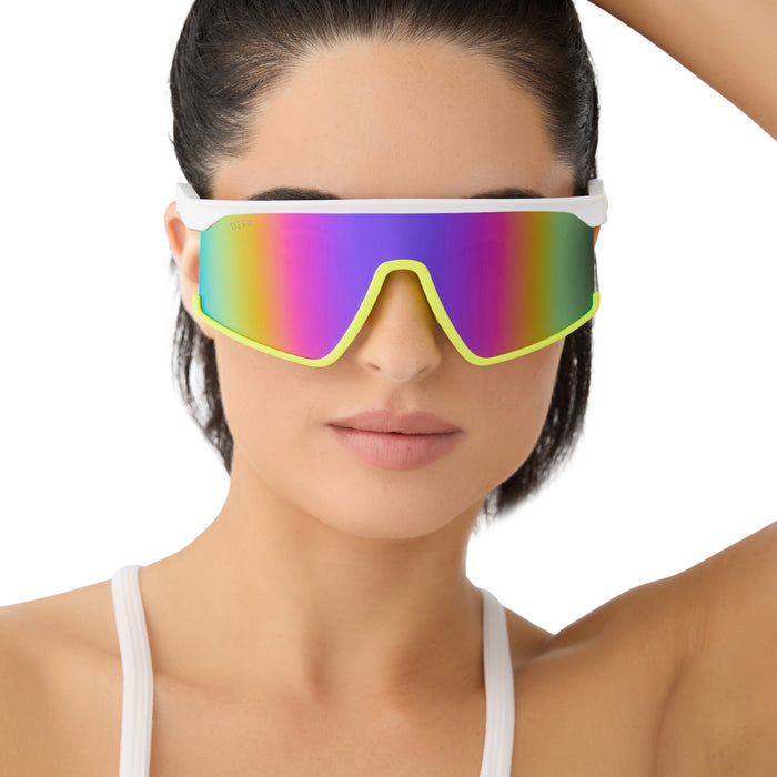 on model - female wearing diff sport featuring the spike shield sunglasses with a matte white + neon yellow + hot pink frame and pink rush mirror polarized lenses front view