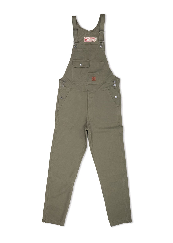 Olive green overalls with adjustable straps, front pocket, and button details, laid flat on a white background.