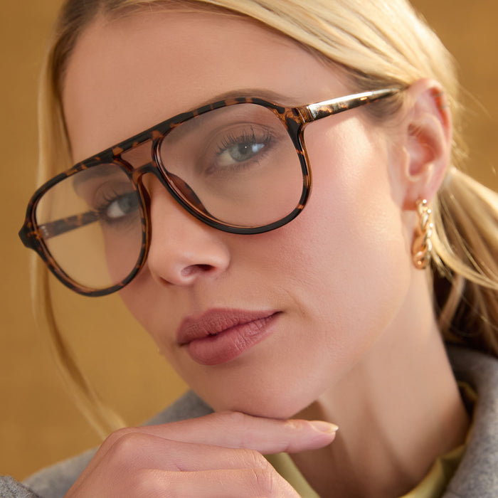 lifestyle - female wearing diff eyewear featuring the tatum aviator prescription glasses with a espresso tortoise frame angled view