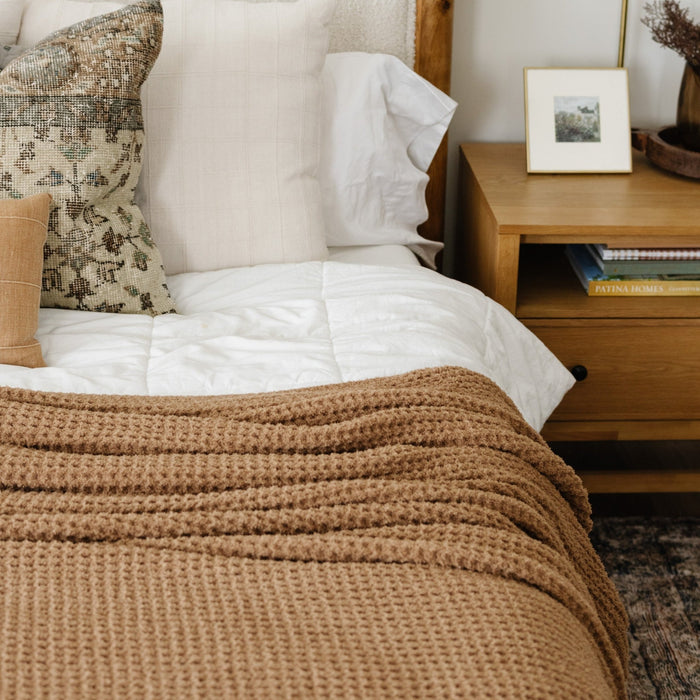 Elegant king waffle knit blanket featuring a classic, grid-like weave.