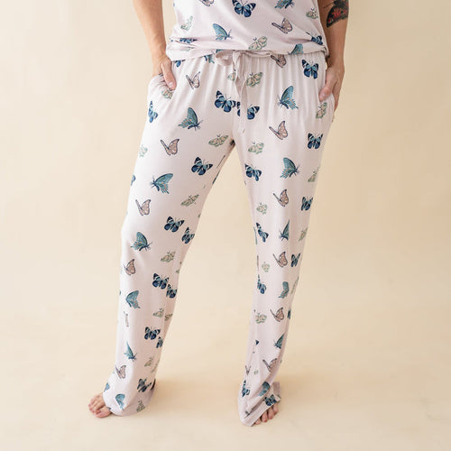 Woman wearing Kyte Baby Women's Lounge Pants in Blush Butterfly