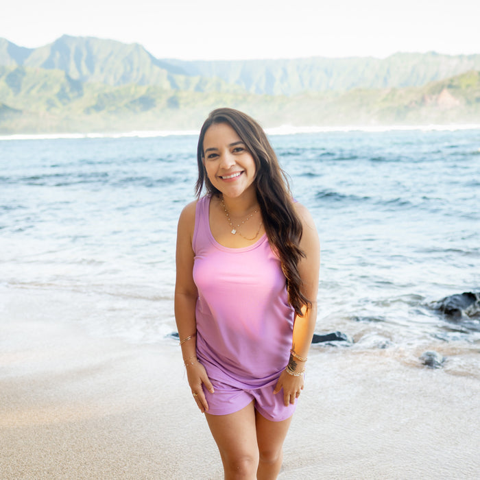 Woman modeling Women’s Tank Set in Poi on beach